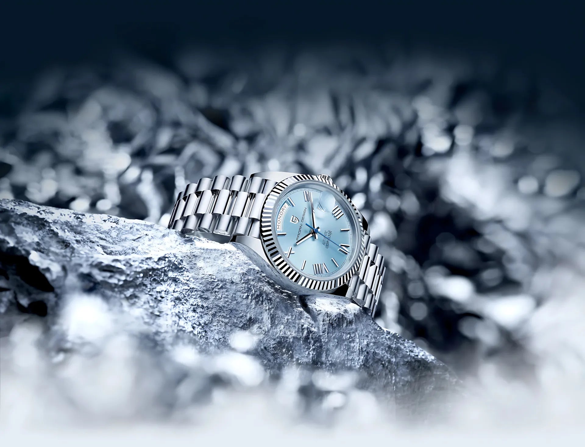 Silver watch with a light blue face on a textured surface